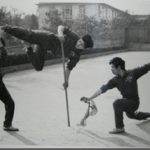 Dr. Tan practicing martial arts with his team members (1983)