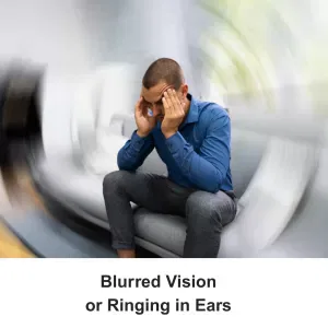 man holding head, with blurred vision circle around him