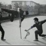 Dr. Tan practicing martial arts with his team members (1983)