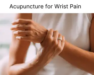 Older woman's hand holding her wrist as if in pain.