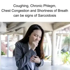 woman coughing into her fist