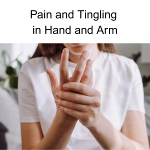 woman holding hand in pain